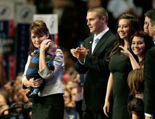 Former Alaska Gov. Sarah Palin holding Trig Palin as her son Track Palin and daughters Bristol, Willow, Piper Palin look on during day three of the Republican National Convention.  Palin's husband Todd Palin and Bristol's boyfriend Levi Johnston are also pictured on the right